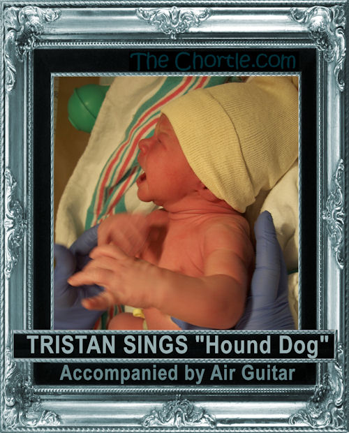 Tristan sings "Hound Dog" accompanied by air guitar