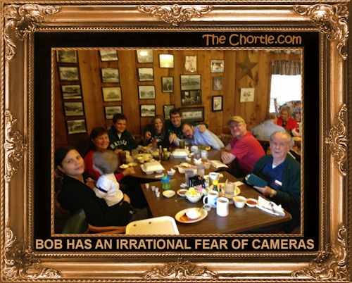 Bob has an irrational fear of cameras