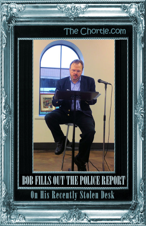 Bob fills out the police report on his recently stolen desk