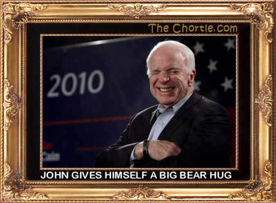 John gives himself a big bear hug.